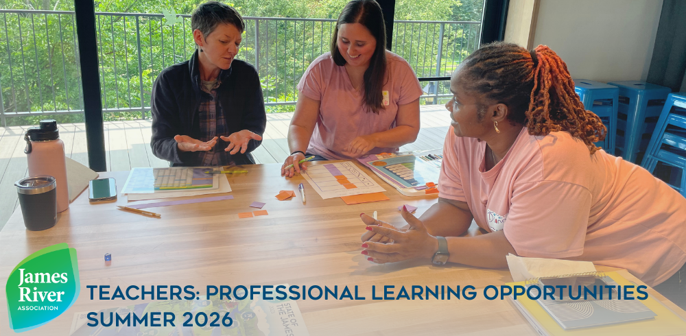 Teachers sitting around a table at the James A. Buzzard River Education Center.